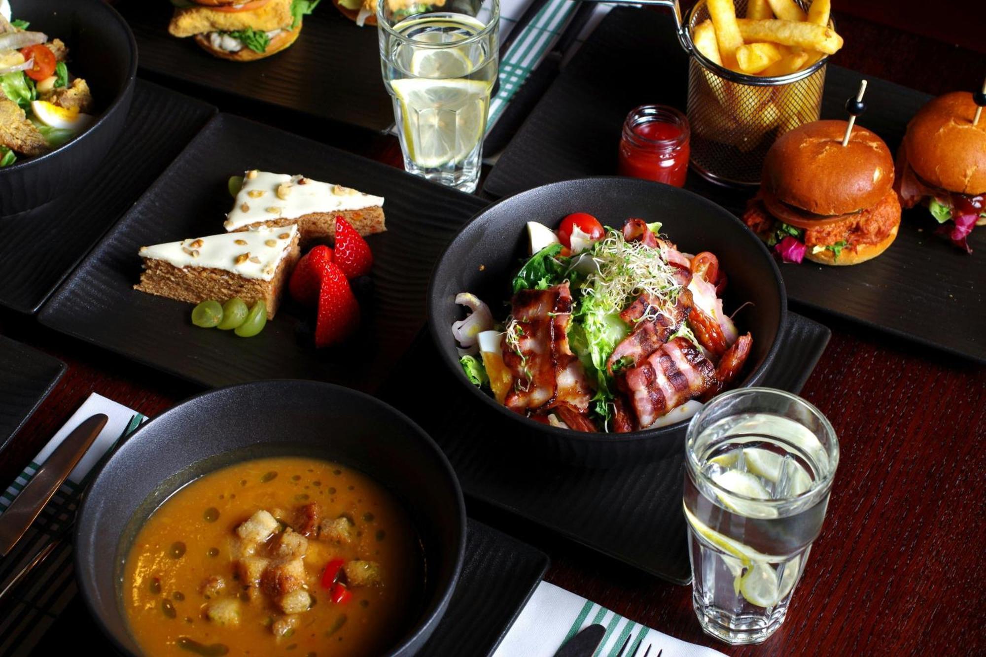 Sheraton Poznan Hotel Ngoại thất bức ảnh A selection of dishes at the restaurant