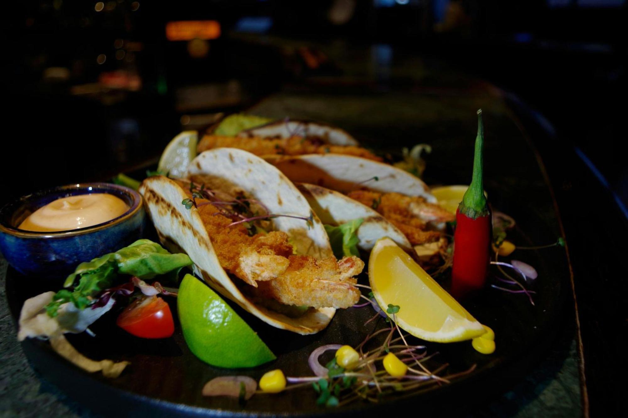 Sheraton Poznan Hotel Ngoại thất bức ảnh A plate of grilled mussels